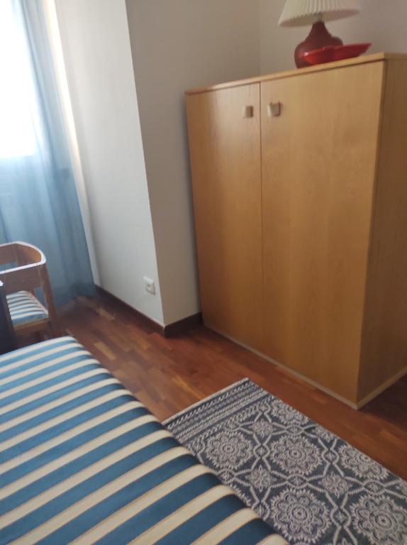 Postel nebo postele na pokoji v ubytování Sette cuscini affittacamere