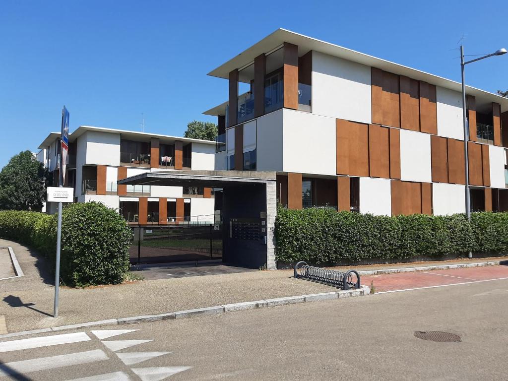 a building on the corner of a street at Room-Apartment 300 meters from the RACETRACK in Imola