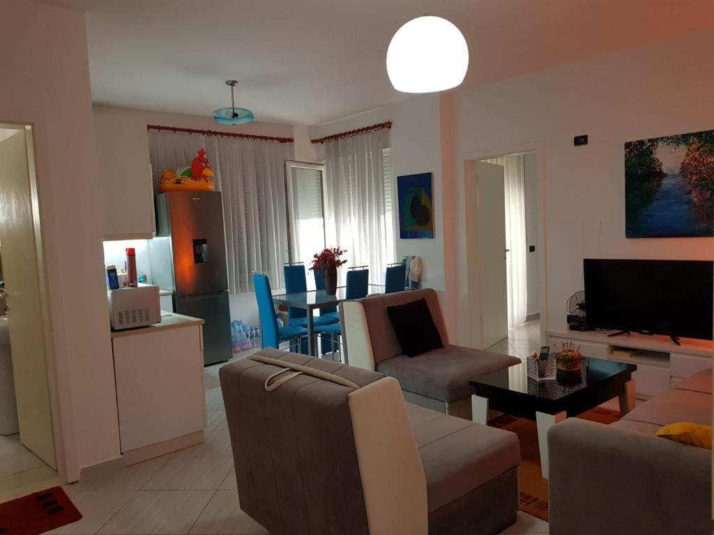 a living room with a couch and a table at Sea retreat apartment in Himare