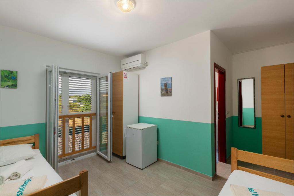 Krevet ili kreveti u jedinici u objektu Hostel & Rooms Vagabundo