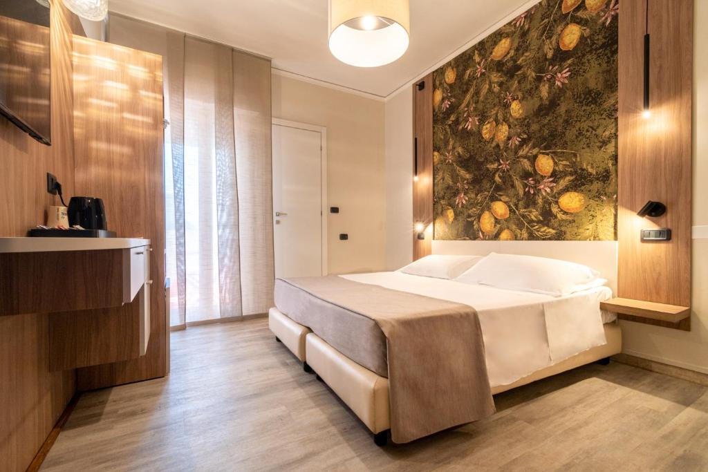 Postel nebo postele na pokoji v ubytování Continental B&B City Hotel