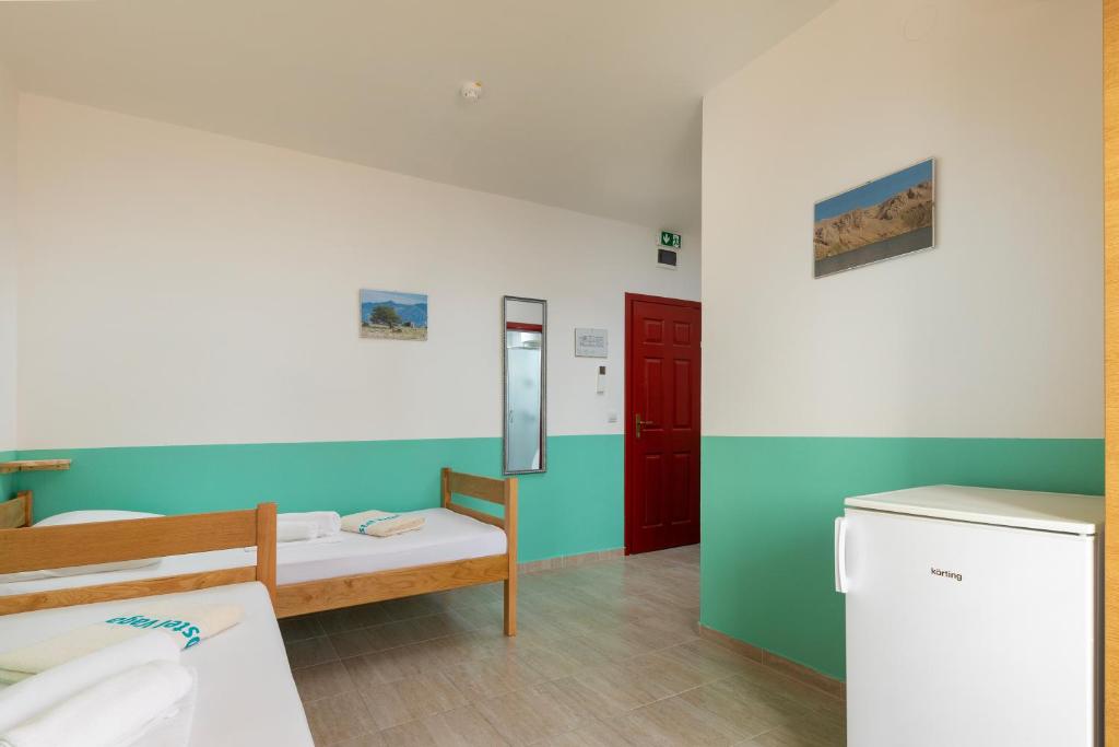 Krevet ili kreveti u jedinici u objektu Hostel & Rooms Vagabundo