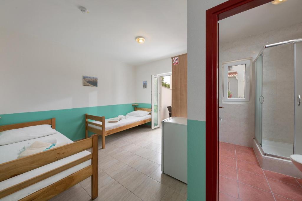 Krevet ili kreveti u jedinici u objektu Hostel & Rooms Vagabundo