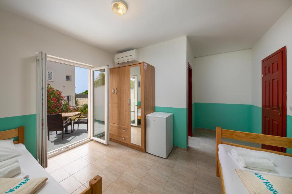 Krevet ili kreveti u jedinici u objektu Hostel & Rooms Vagabundo