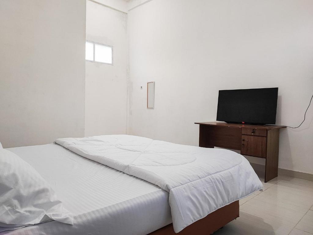 Adela Homestay Syariah Near Universitas Muhammadiyah Jambi Mitra RedDoorz - Standaard King Kamer