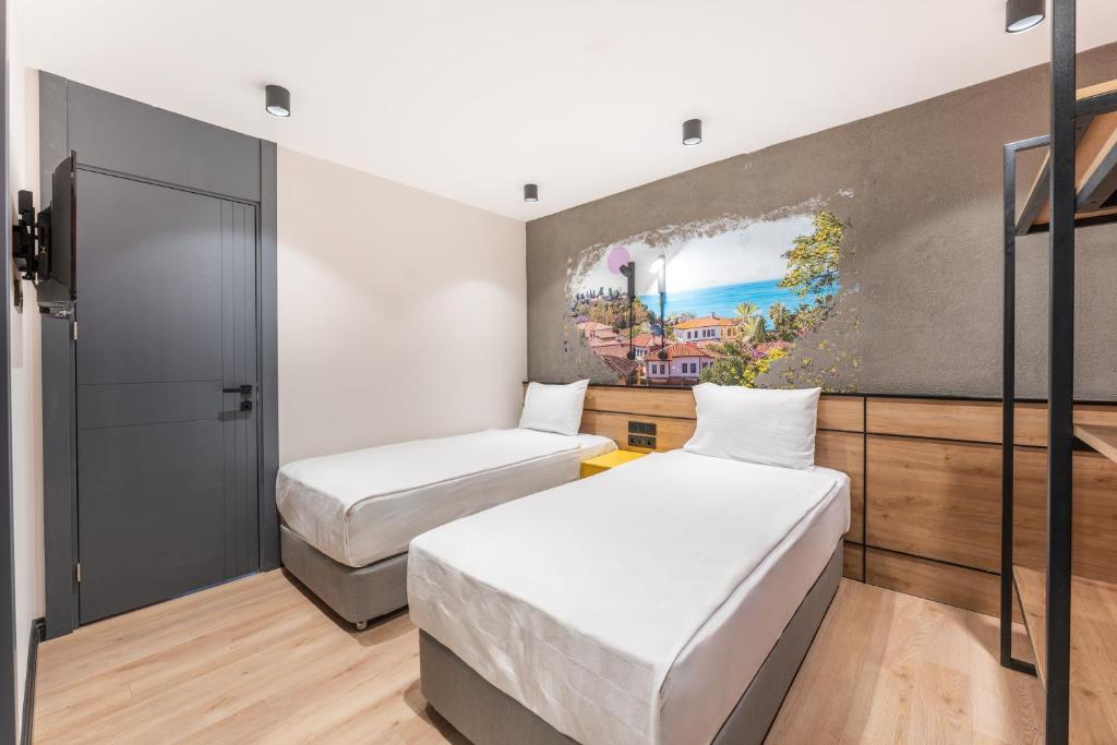 Postel nebo postele na pokoji v ubytování Just Inn City