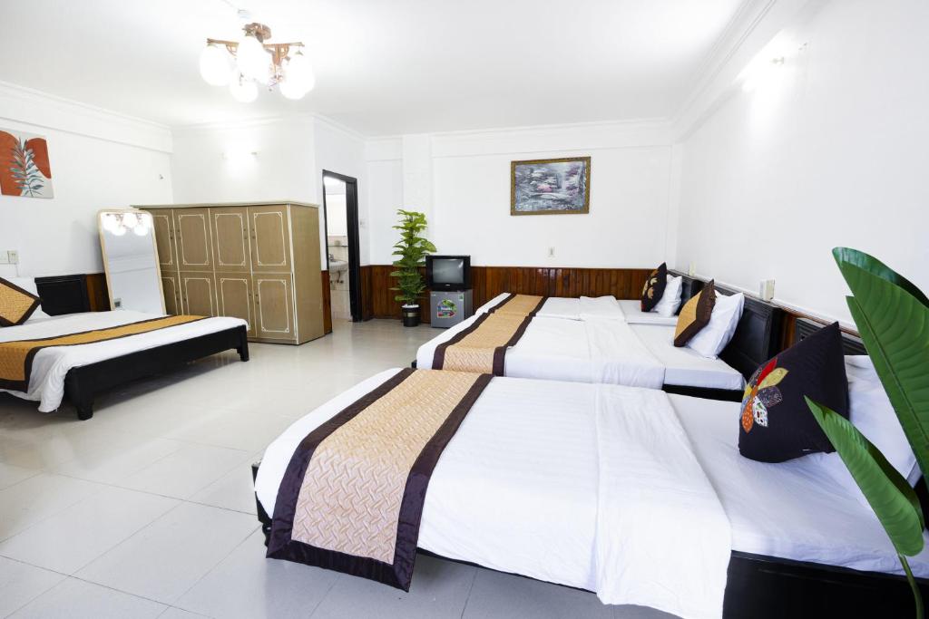 Postel nebo postele na pokoji v ubytování Casablanca Hotel