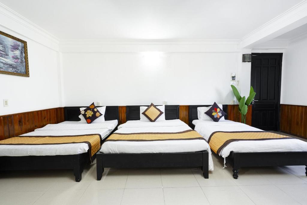 Postel nebo postele na pokoji v ubytování Casablanca Hotel