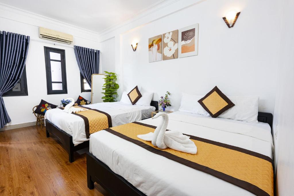 Postel nebo postele na pokoji v ubytování Casablanca Hotel