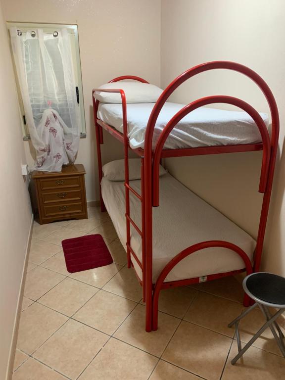 Postel nebo postele na pokoji v ubytování Casa vacanze Tilly