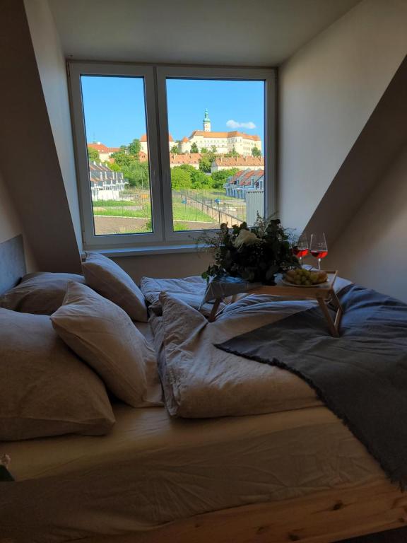 Postel nebo postele na pokoji v ubytování Zámek na dlani Mikulov