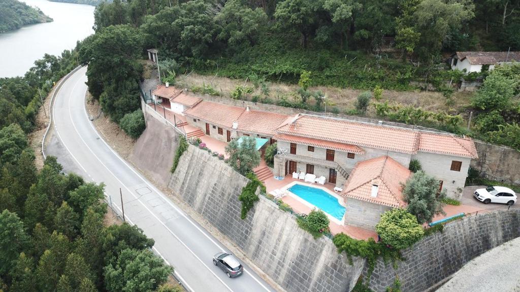 an aerial view of a house and a road at Casa do Avô in Entre-os-Rios