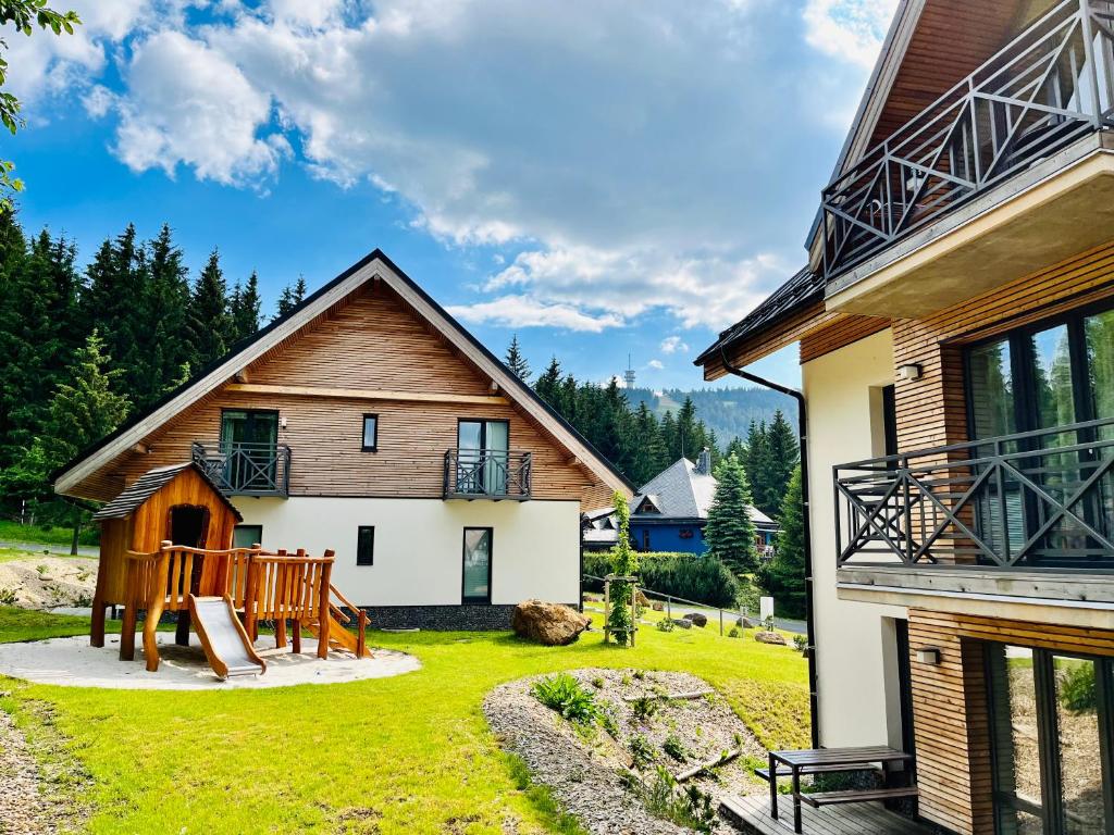 a home with a yard with a house at Ski Chalet Klínovec in Loučná pod Klínovcem