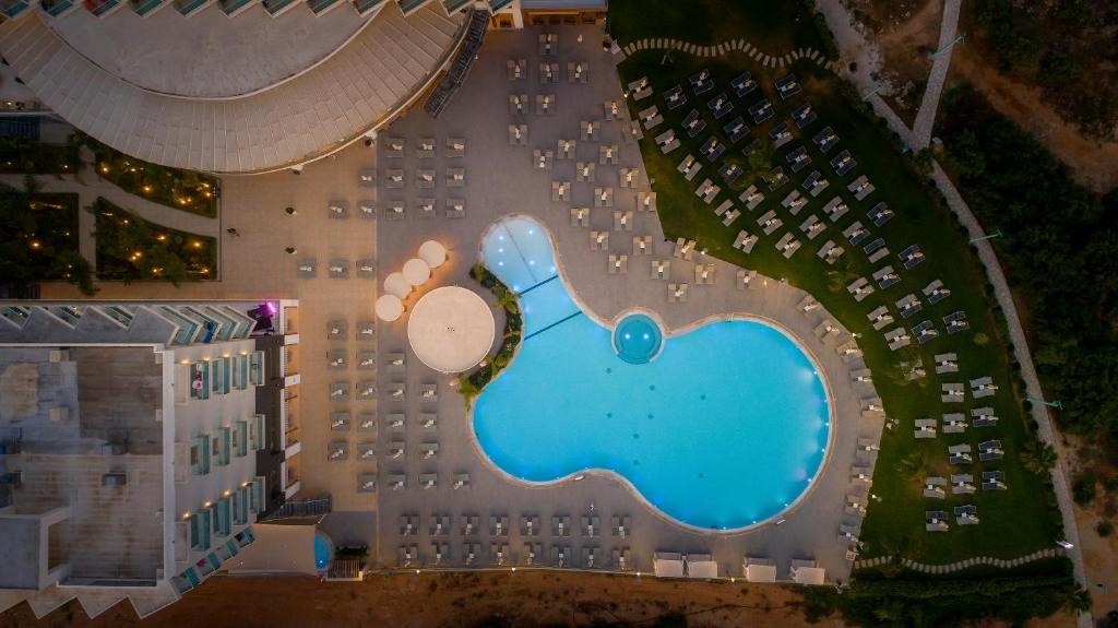 an overhead view of a hotel with a swimming pool at NissiBlu Beach Resort in Ayia Napa