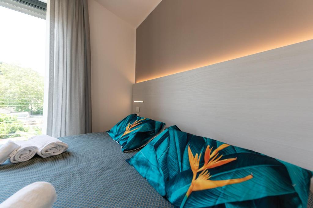 Postel nebo postele na pokoji v ubytování Hotel La Bussola
