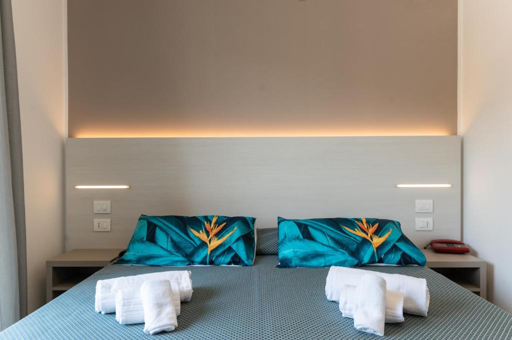 Postel nebo postele na pokoji v ubytování Hotel La Bussola
