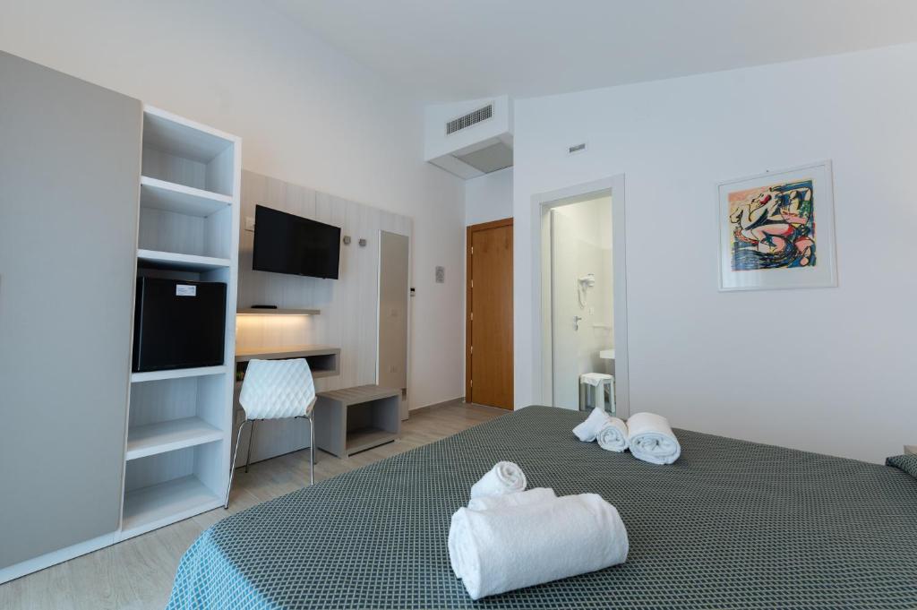 Postel nebo postele na pokoji v ubytování Hotel La Bussola