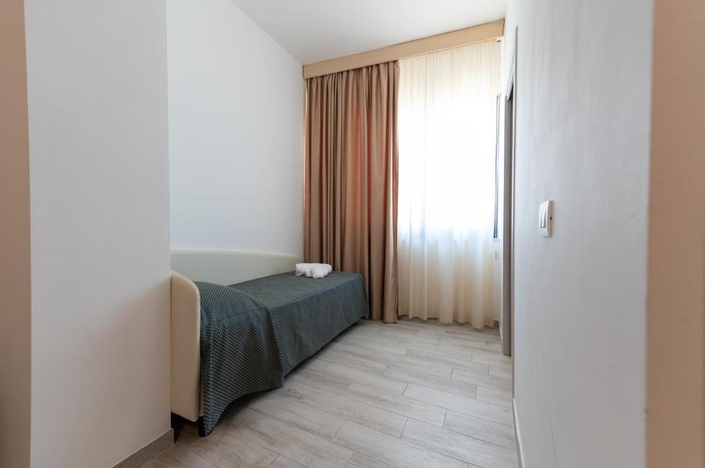 Postel nebo postele na pokoji v ubytování Hotel La Bussola