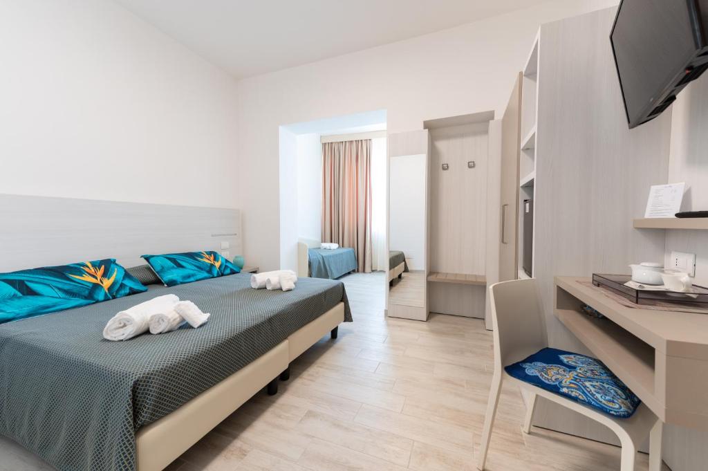 Postel nebo postele na pokoji v ubytování Hotel La Bussola