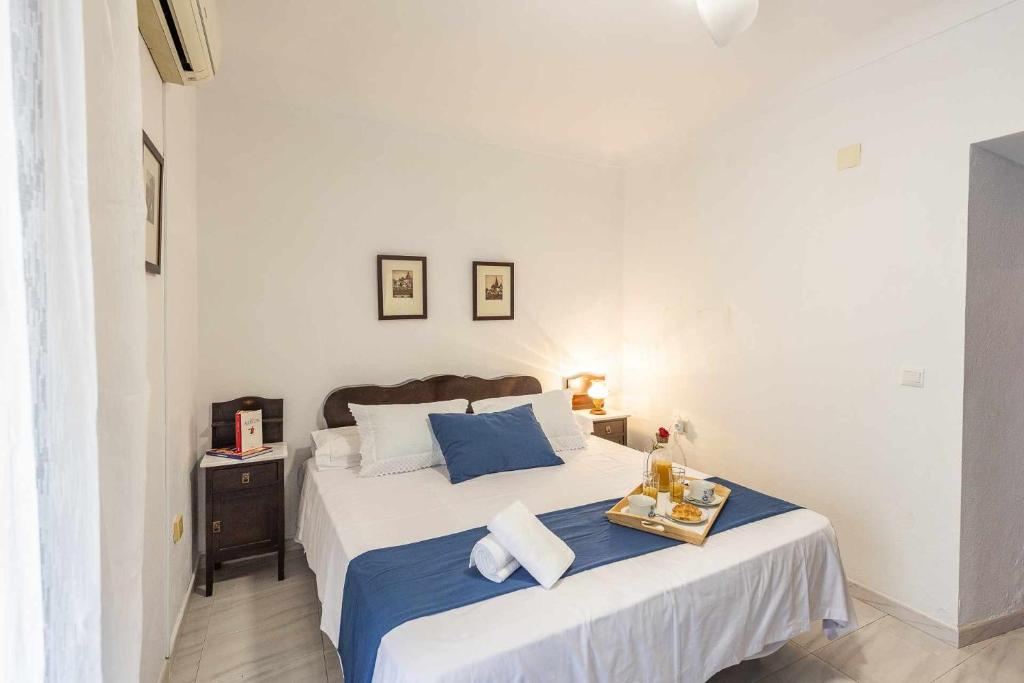 Postel nebo postele na pokoji v ubytování Casa Rural Berraquero