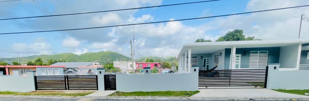 a house with a fence in front of it at Home for your stay in Humacao
