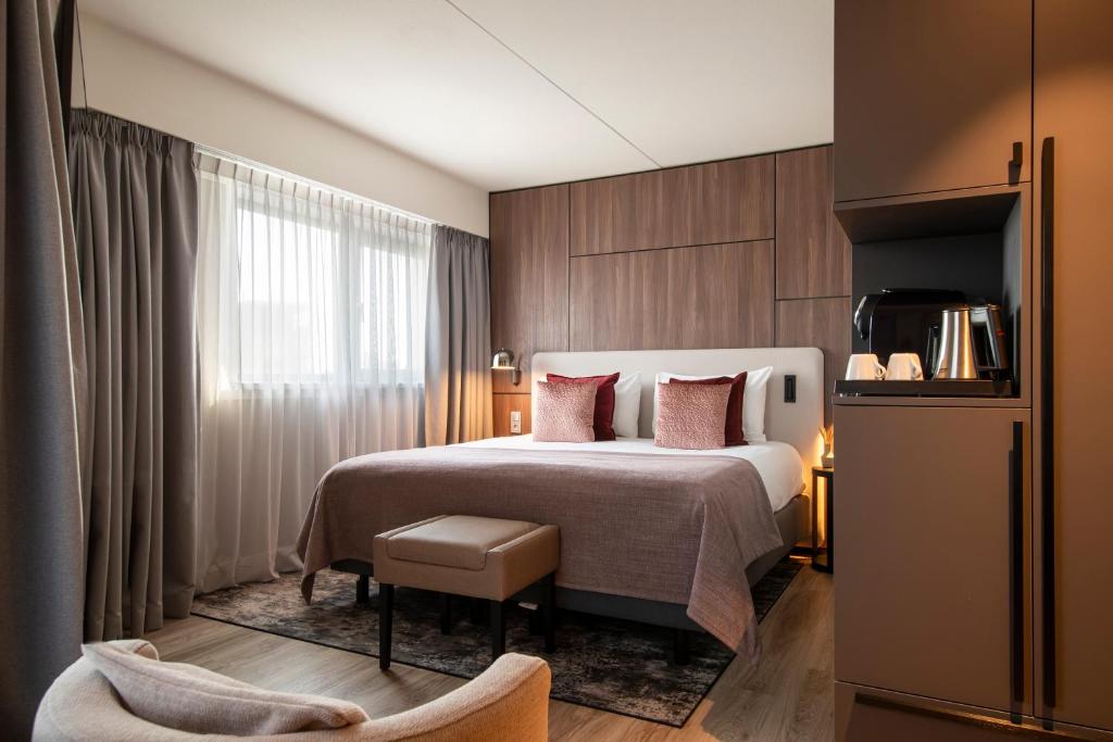 Postel nebo postele na pokoji v ubytování Bilderberg Europa Hotel Scheveningen