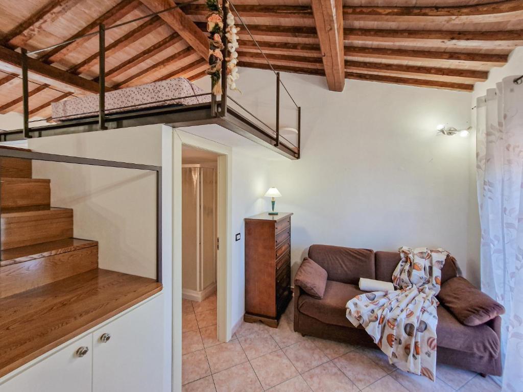 a living room with a couch and a loft at Loft Honeymoon Rio Elba old town in Rio nellʼElba