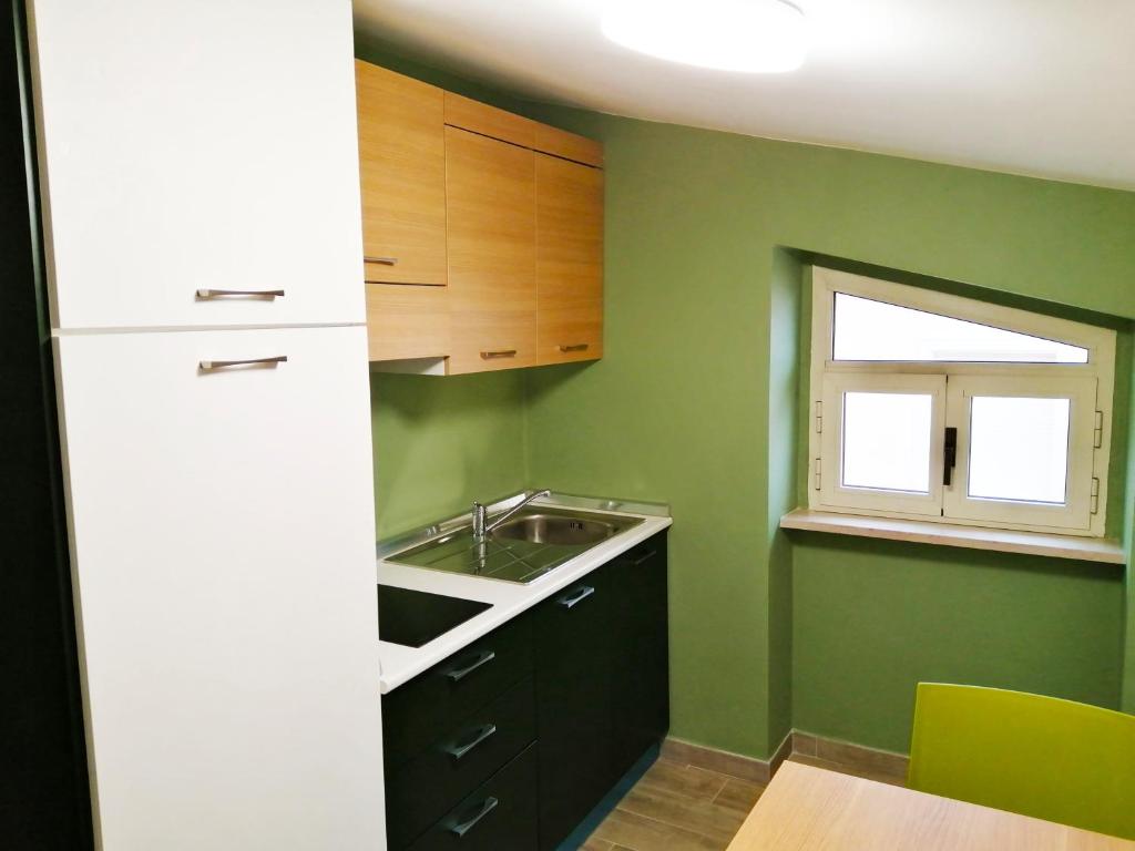 Kuchyň nebo kuchyňský kout v ubytování HOTEL HOUSE GARGANO