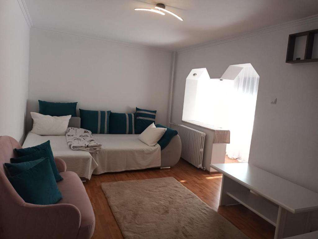 a living room with two beds and a couch at Acasă in Drobeta-Turnu Severin