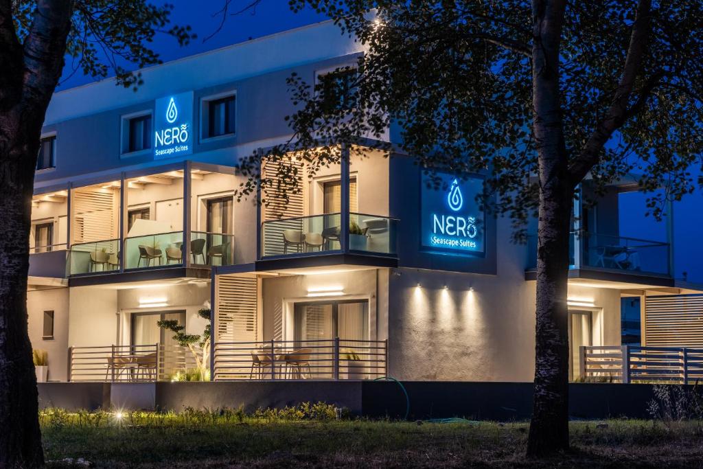 a night view of the nest hotel at NERO SEASCAPE SUITES in Fanárion