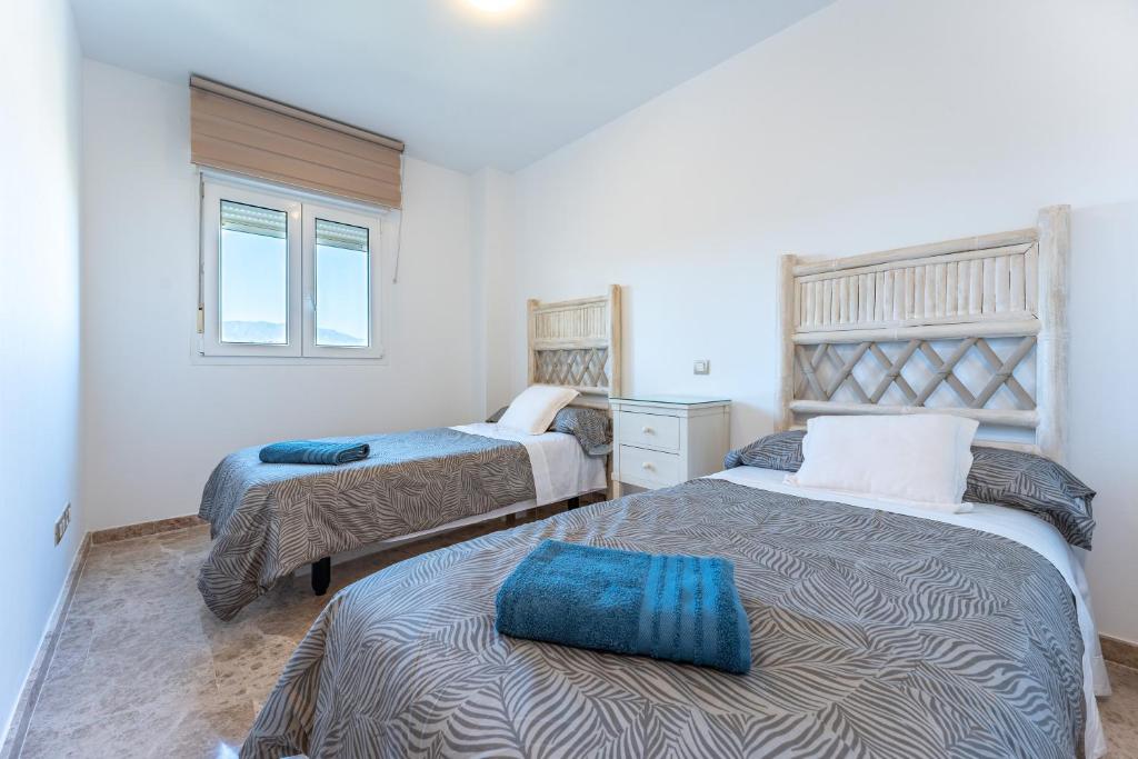 Posteľ alebo postele v izbe v ubytovaní Apartamento Cala de mijas