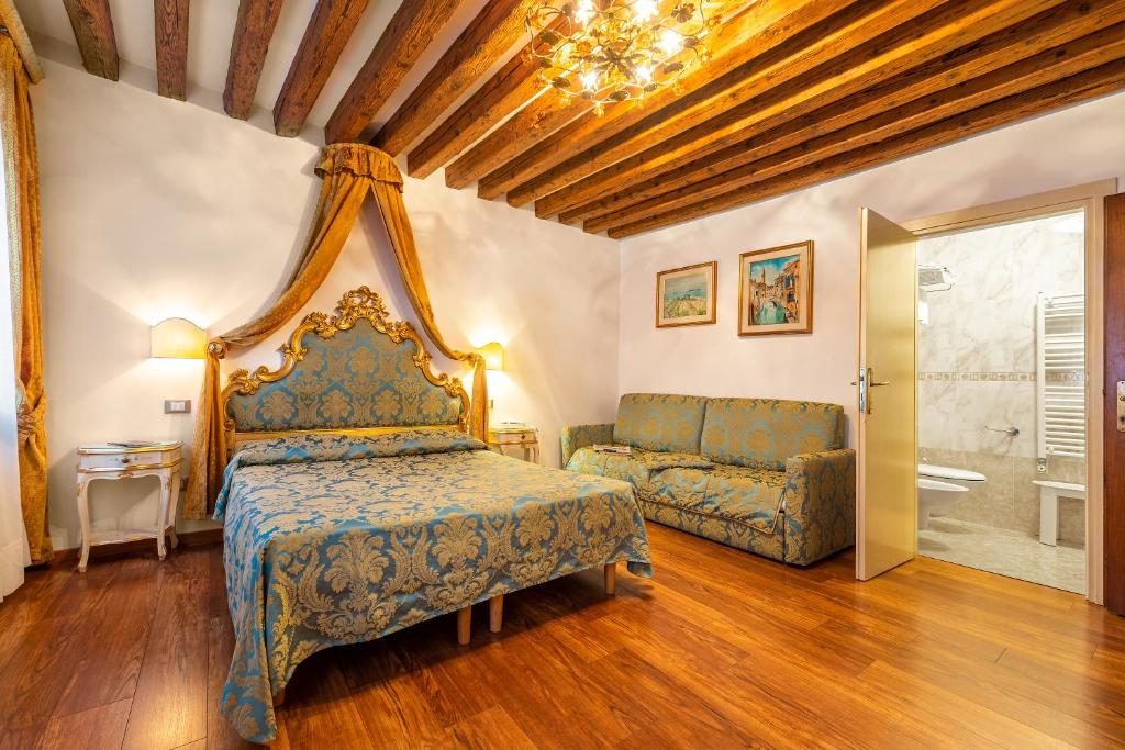 Postel nebo postele na pokoji v ubytování Hotel Al Vagon