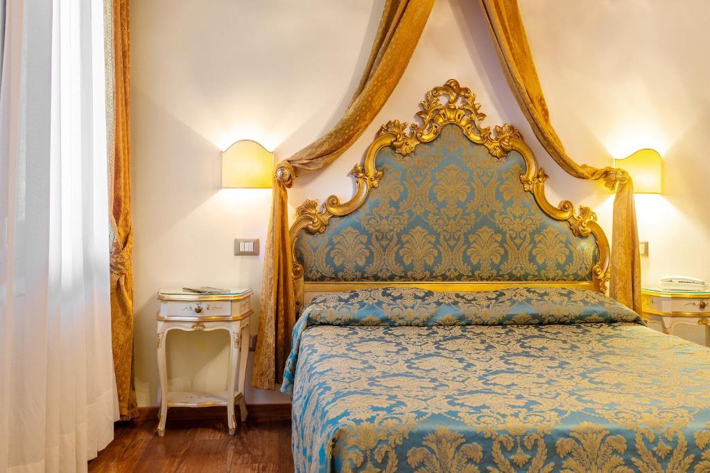 Postel nebo postele na pokoji v ubytování Hotel Al Vagon