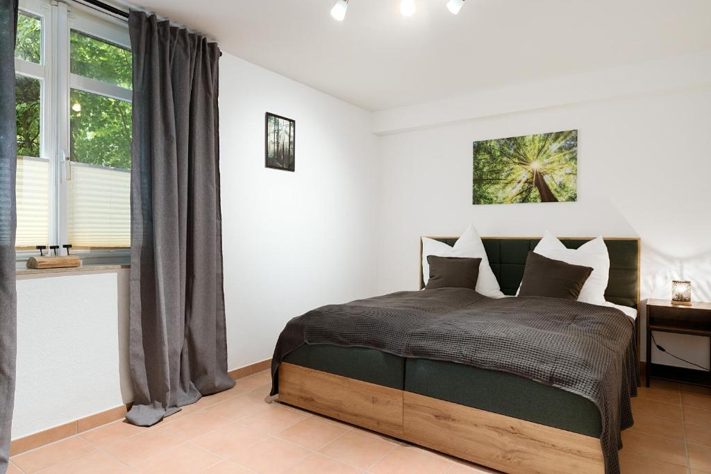 Voodi või voodid majutusasutuse EasyWood modernes Apartment 4P by EasyHood toas
