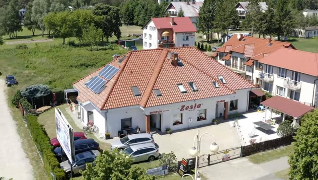 an aerial view of a house with a roof at Villa Zosia in Rowy