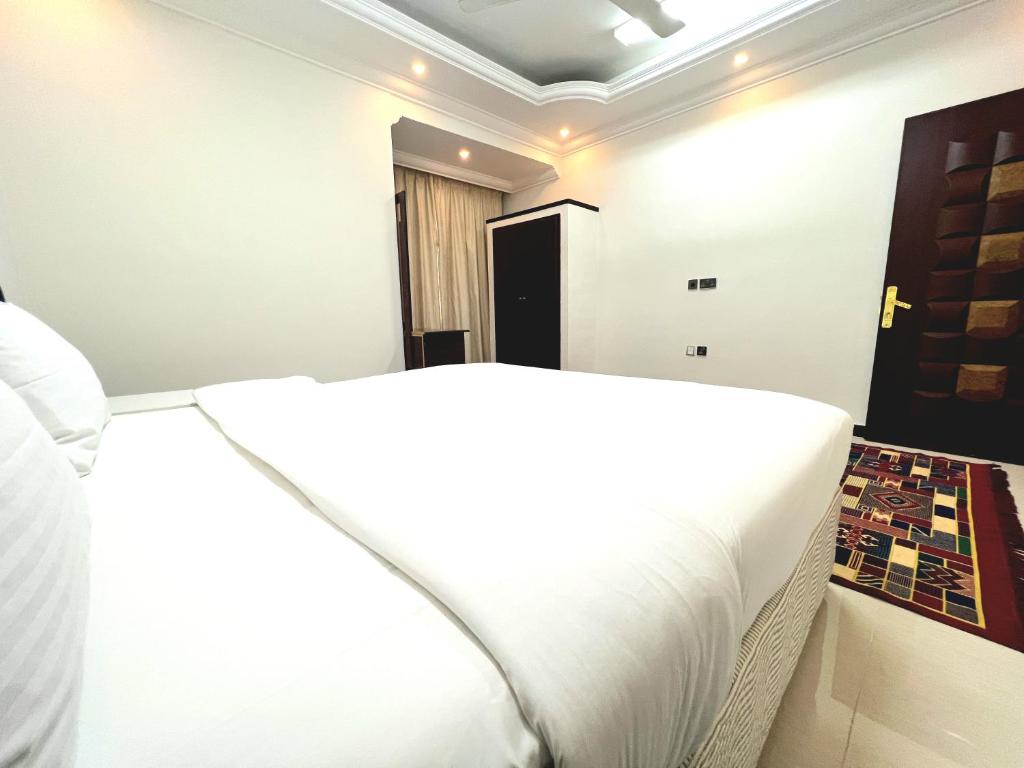 Voodi või voodid majutusasutuse Al Taraf Hotel Apartment toas