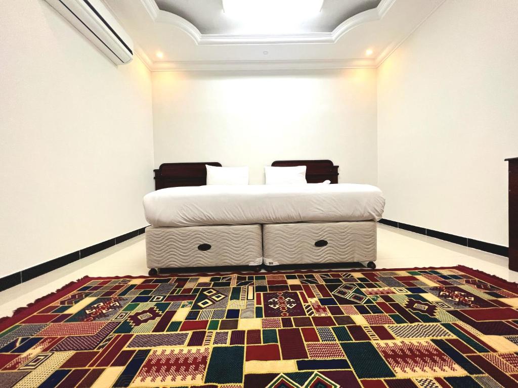 Voodi või voodid majutusasutuse Al Taraf Hotel Apartment toas