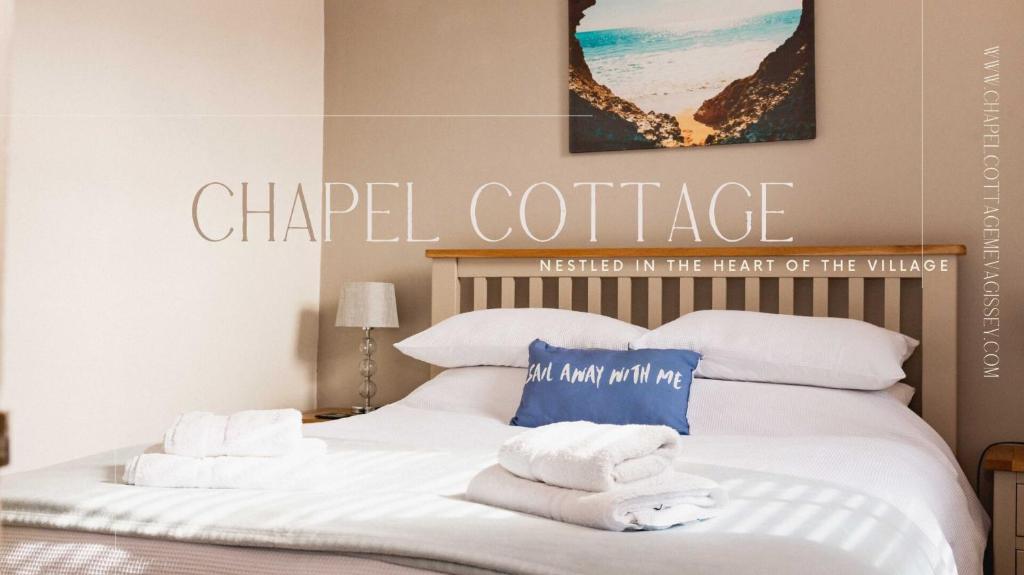 A bed or beds in a room at Chapel Cottage