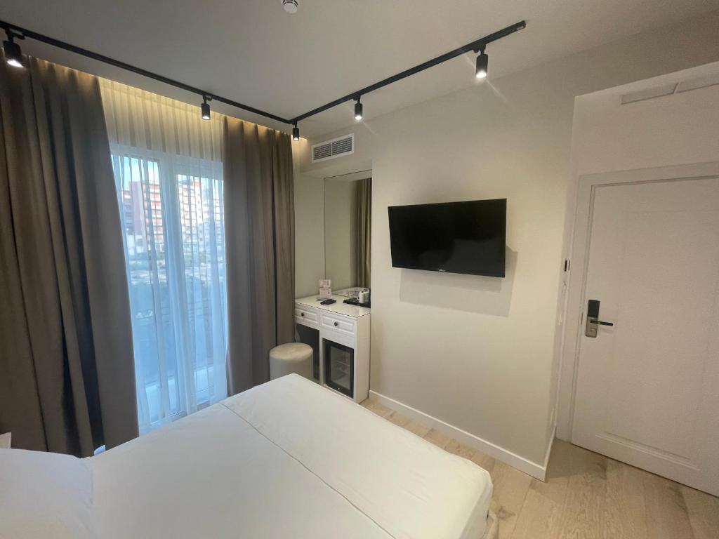 Postel nebo postele na pokoji v ubytování Seaside Hotel