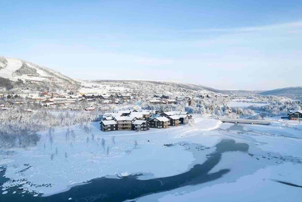 an aerial view of a village in the snow at Fin leilighet på Geilotunet leies ut in Geilo