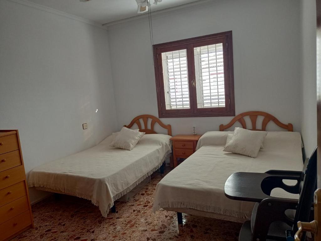 מיטה או מיטות בחדר ב-Casa Azul
