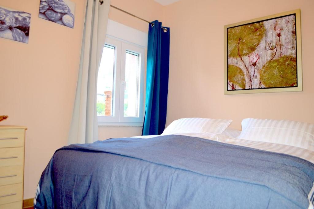 Postel nebo postele na pokoji v ubytování Wohnung mit Meerblick Romy