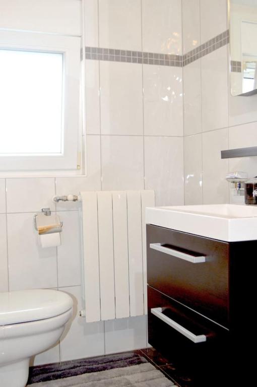Koupelna v ubytování Wohnung mit Meerblick Romy