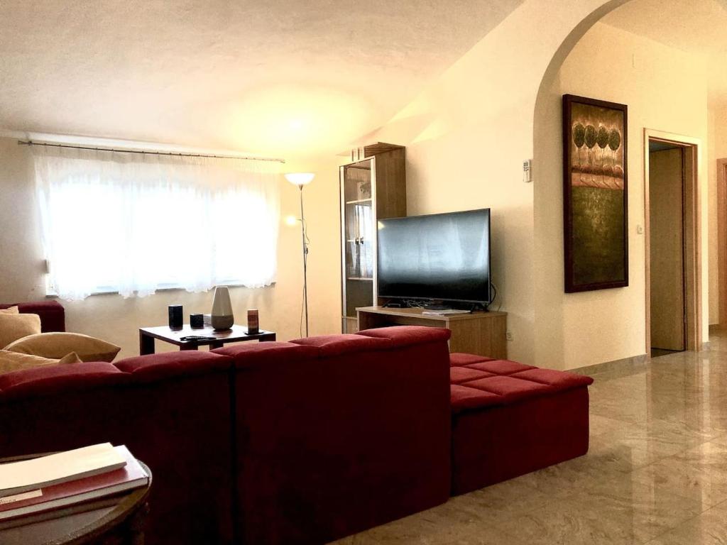 TV a/nebo společenská místnost v ubytování Wohnung mit Meerblick Romy