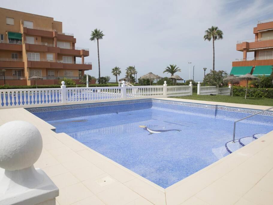 a large swimming pool in a resort at Jardines del Mar Salobreña in Salobreña