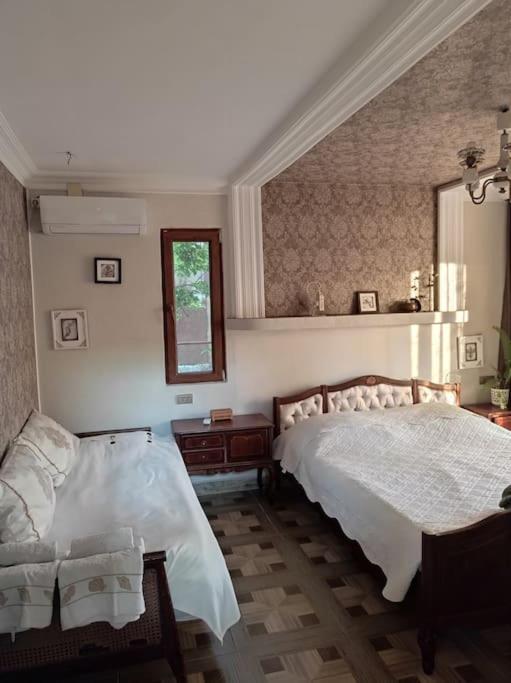Postel nebo postele na pokoji v ubytování Guest house “Tamari’s”