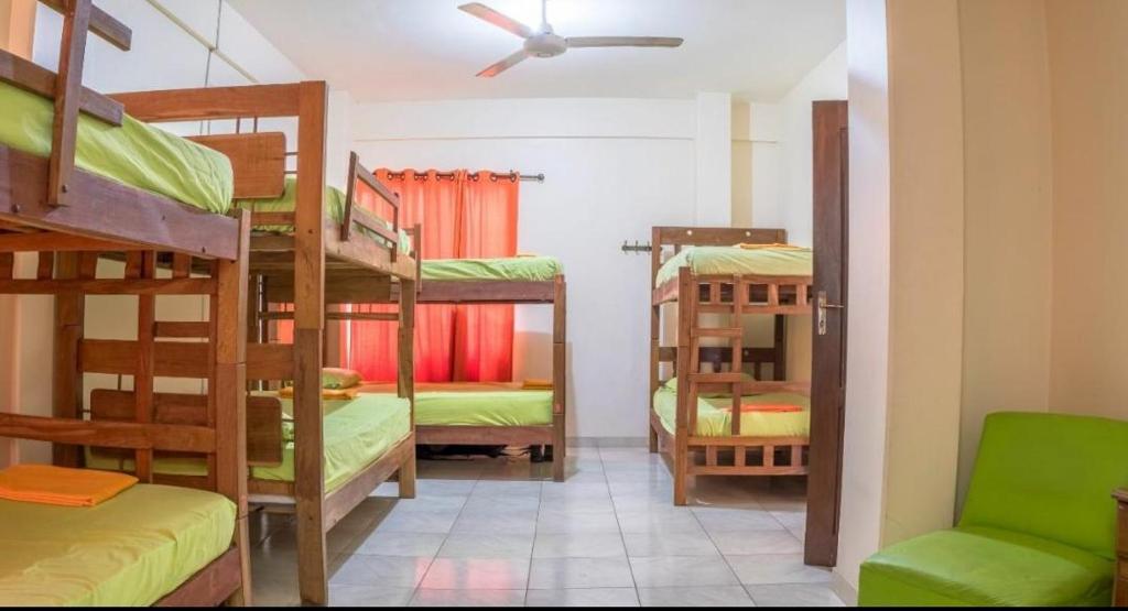 a room with several bunk beds in a room at Hostal Killa360 Luna in Santa Cruz de la Sierra