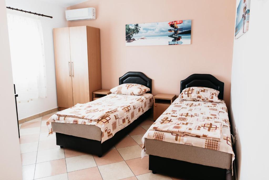 Postel nebo postele na pokoji v ubytování Guest House Lalic