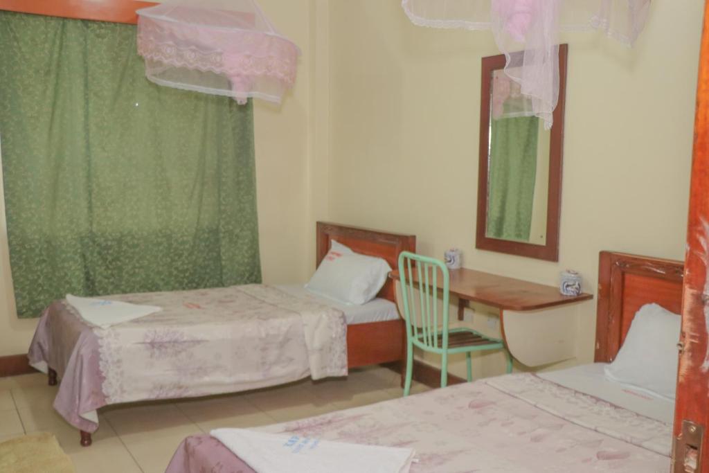 Postel nebo postele na pokoji v ubytování KAP Guest House