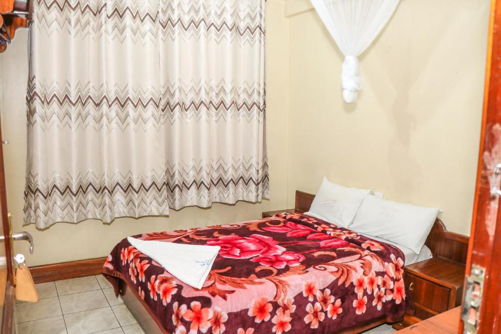 Postel nebo postele na pokoji v ubytování KAP Guest House